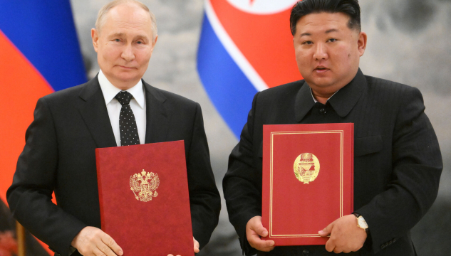 Vladimir Putin og Kim Jong- un